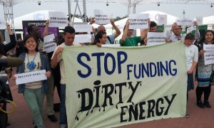 Protests in Lima against UN climate fund support for dirty energy projects.