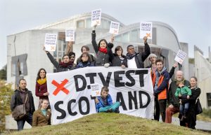 Divest Scotland campaigners outside the Scottish Parliament