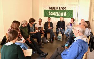 Group of Scottish activists discussing fossil free Scotland