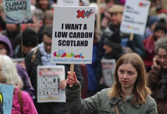 Person with 'I want a low Carbon Scotland' placard at Climate March 2015