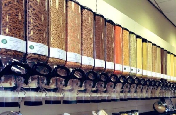 Row of dispensers of dried foods in a plastic free shop