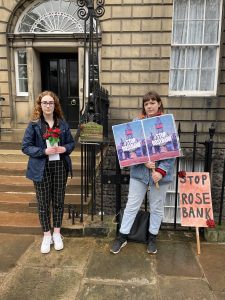 two women delivering roses outside the First Minister's residence