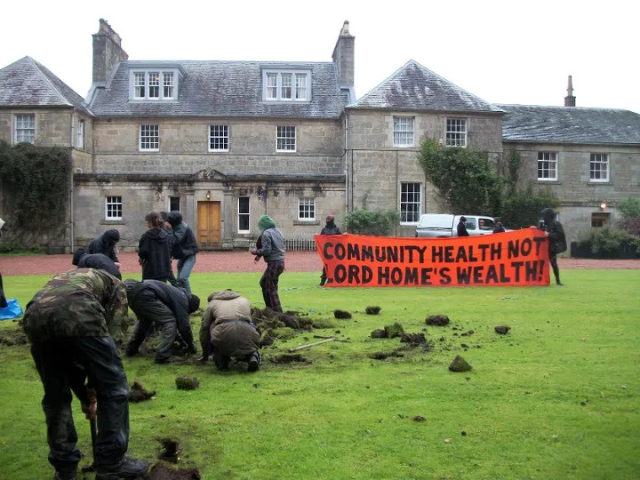 People digging holes in the lawn of a big house